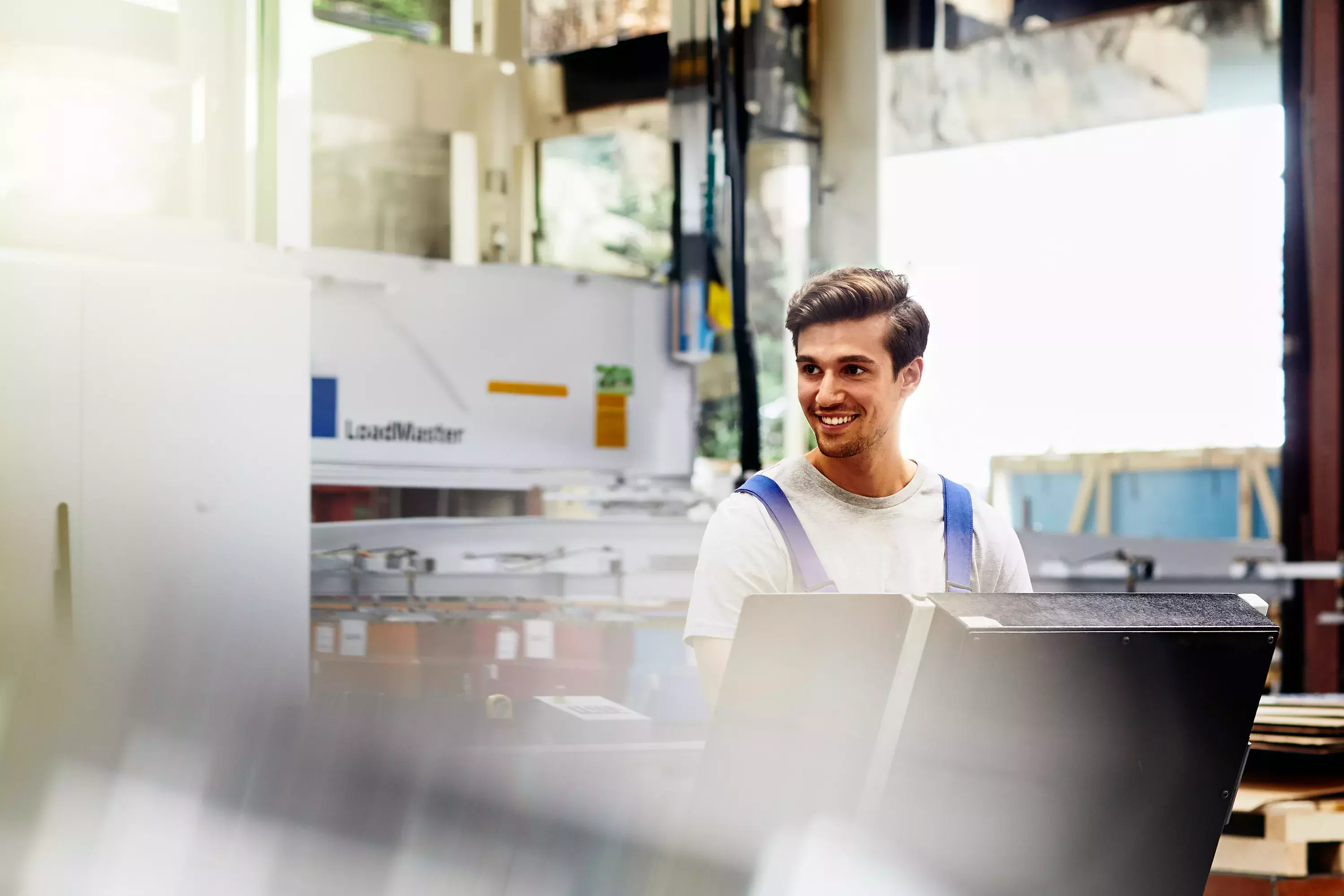 Smiling male on a production site
